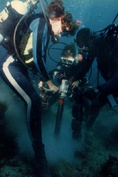 Drilling into fossilized coral to install mooring