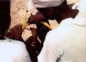 Volunteers learning to splice buoy lines (Negril, Jamaica).